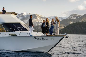 a group of people on a boat in the water