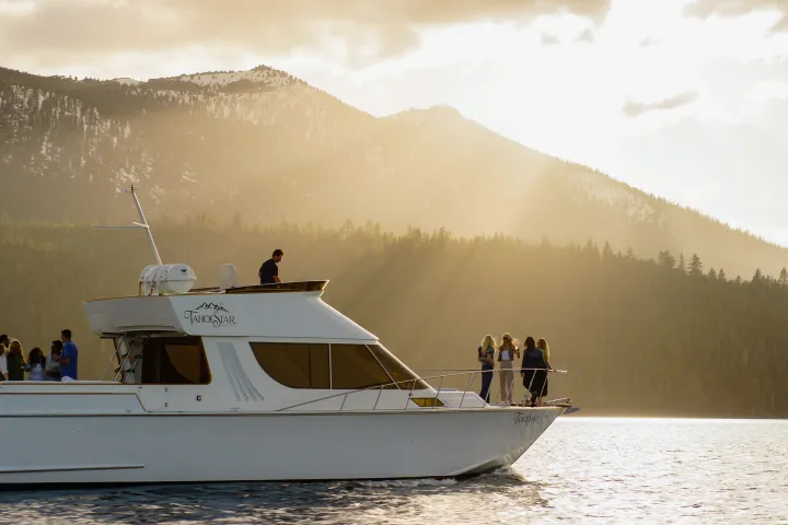 a group of people in a boat on a body of water