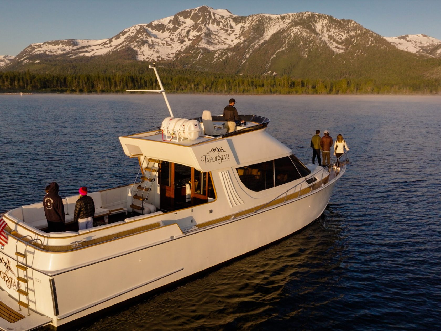 a small boat in a body of water with a mountain in the background