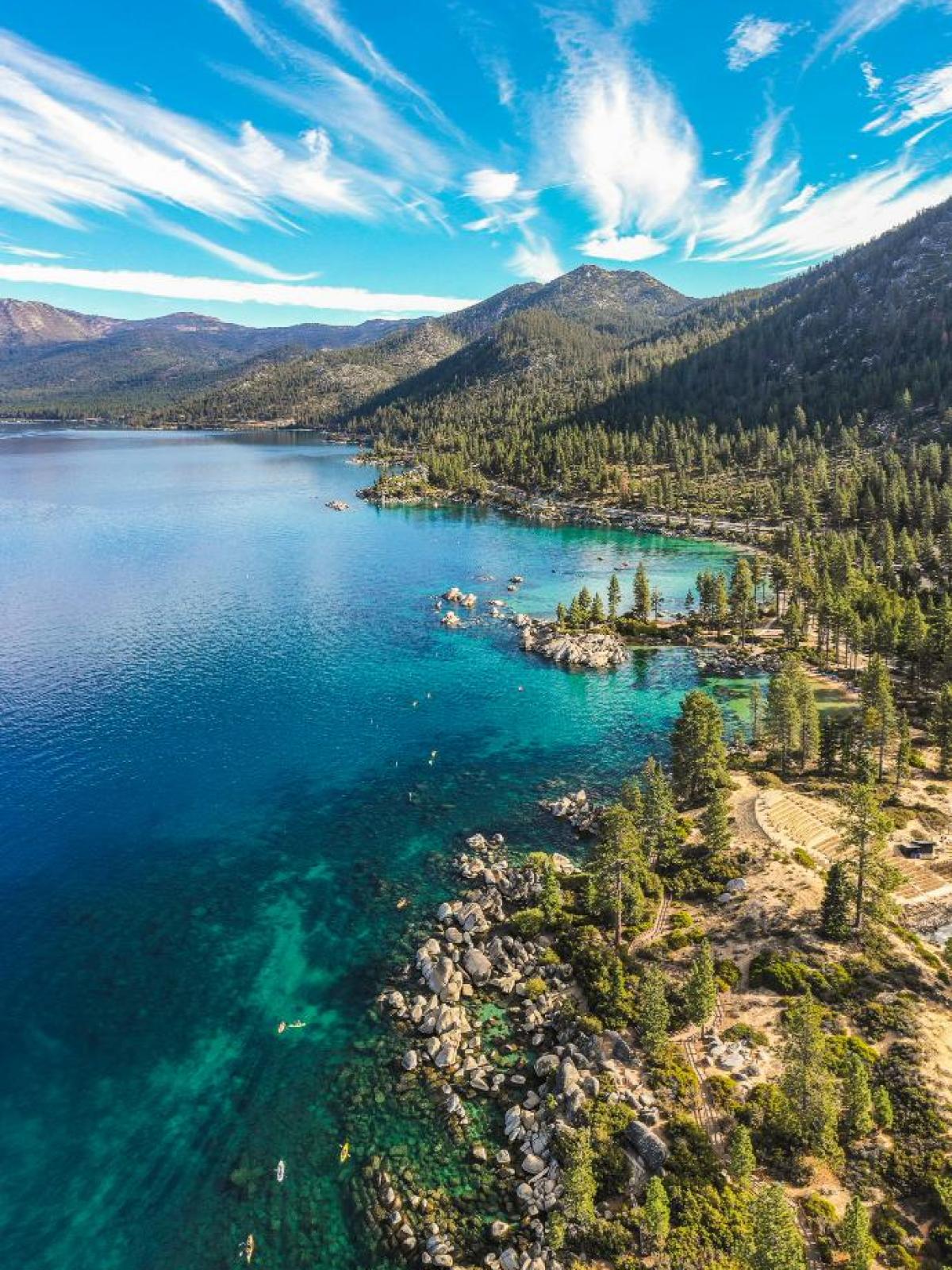 a body of water with a mountain in the background