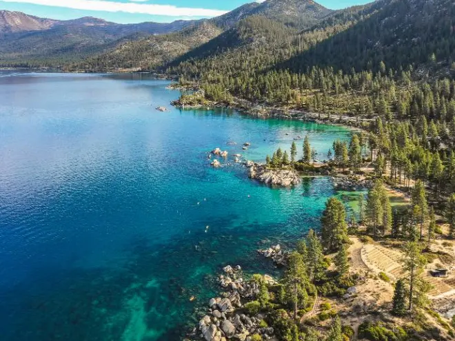 a body of water with a mountain in the background