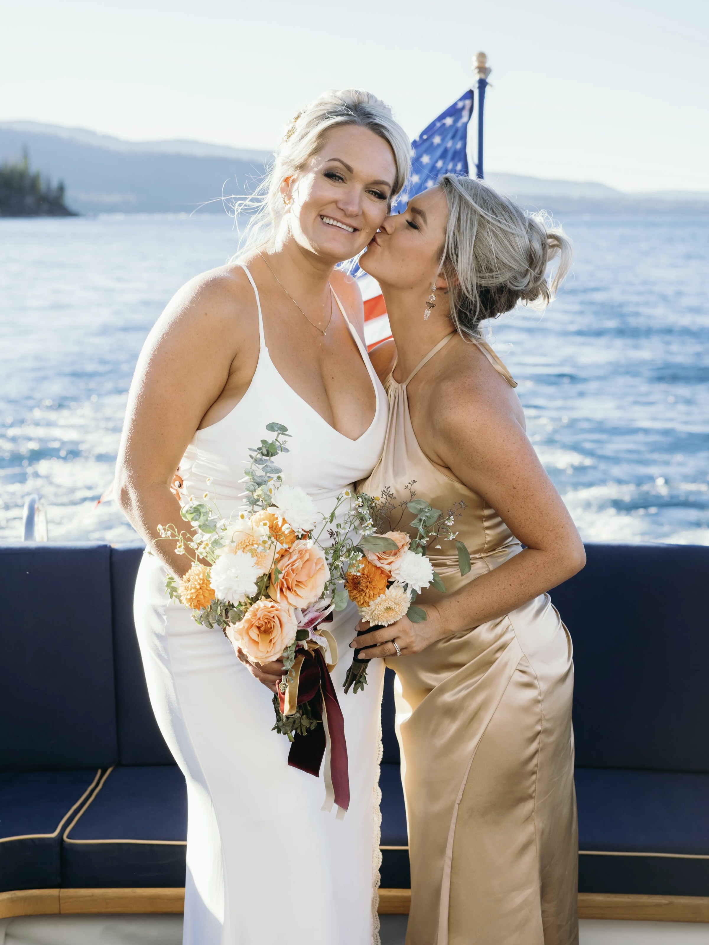 a woman standing in front of a body of water