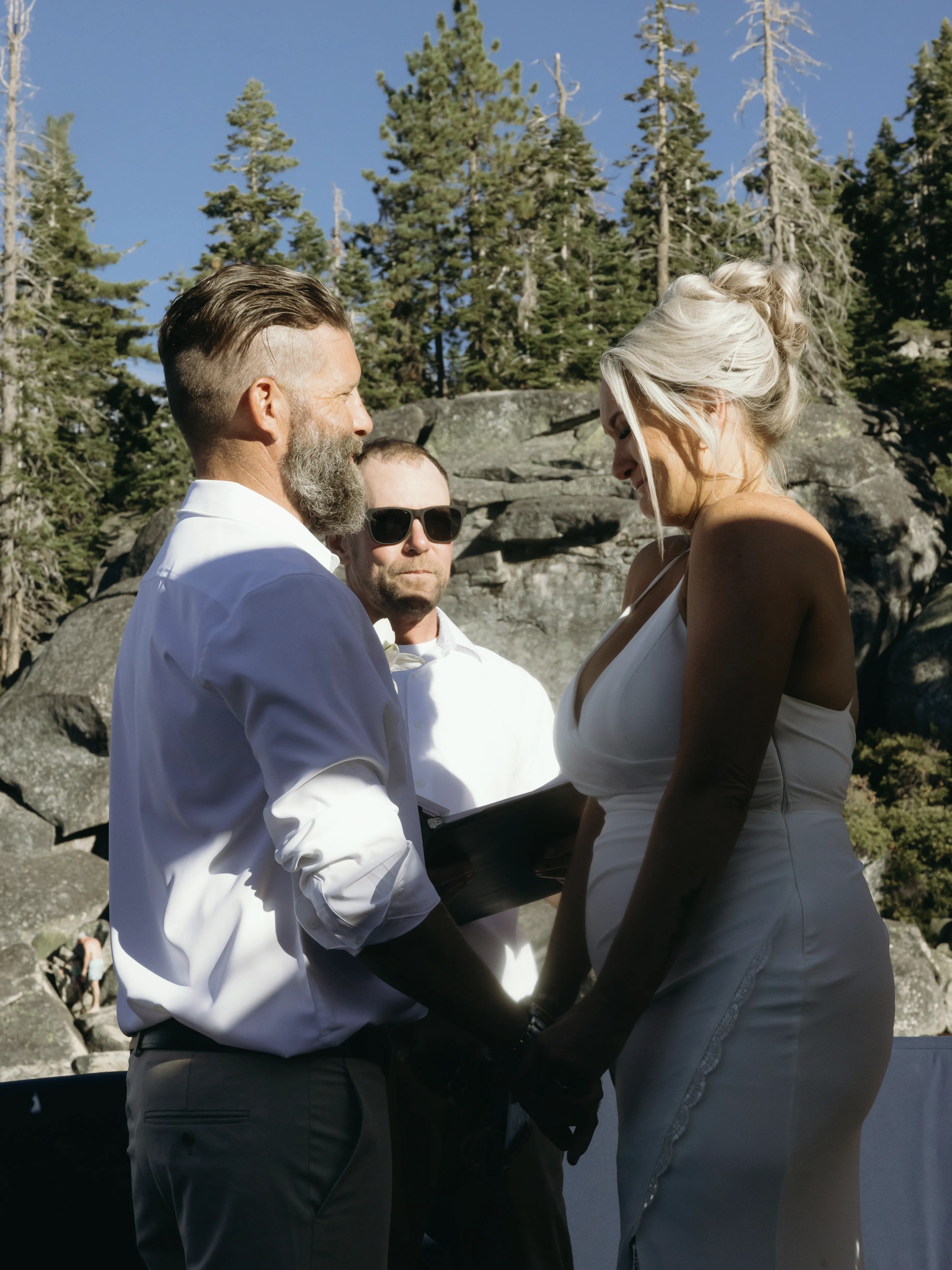 a man standing next to a woman