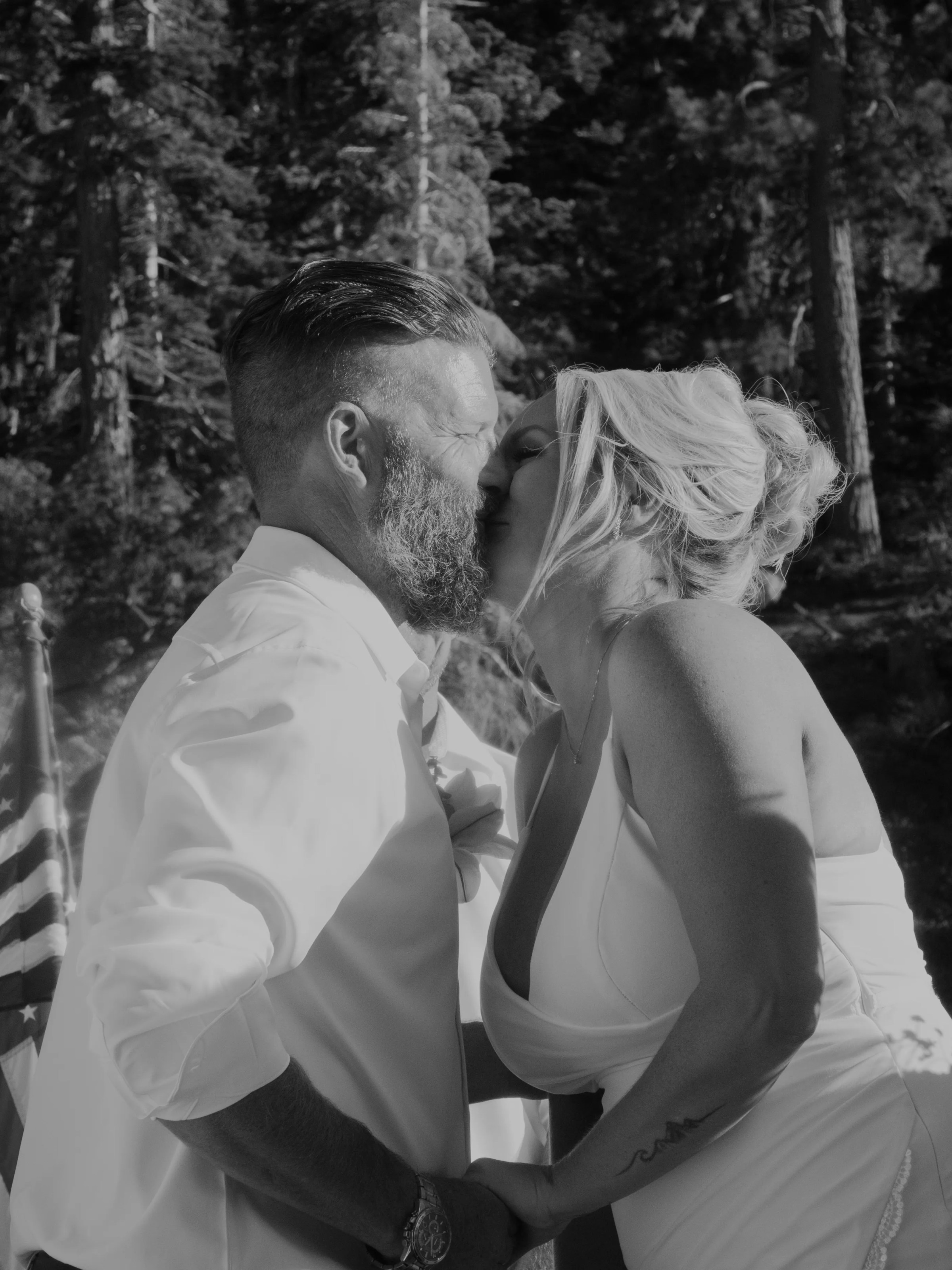 a person standing next to a forest