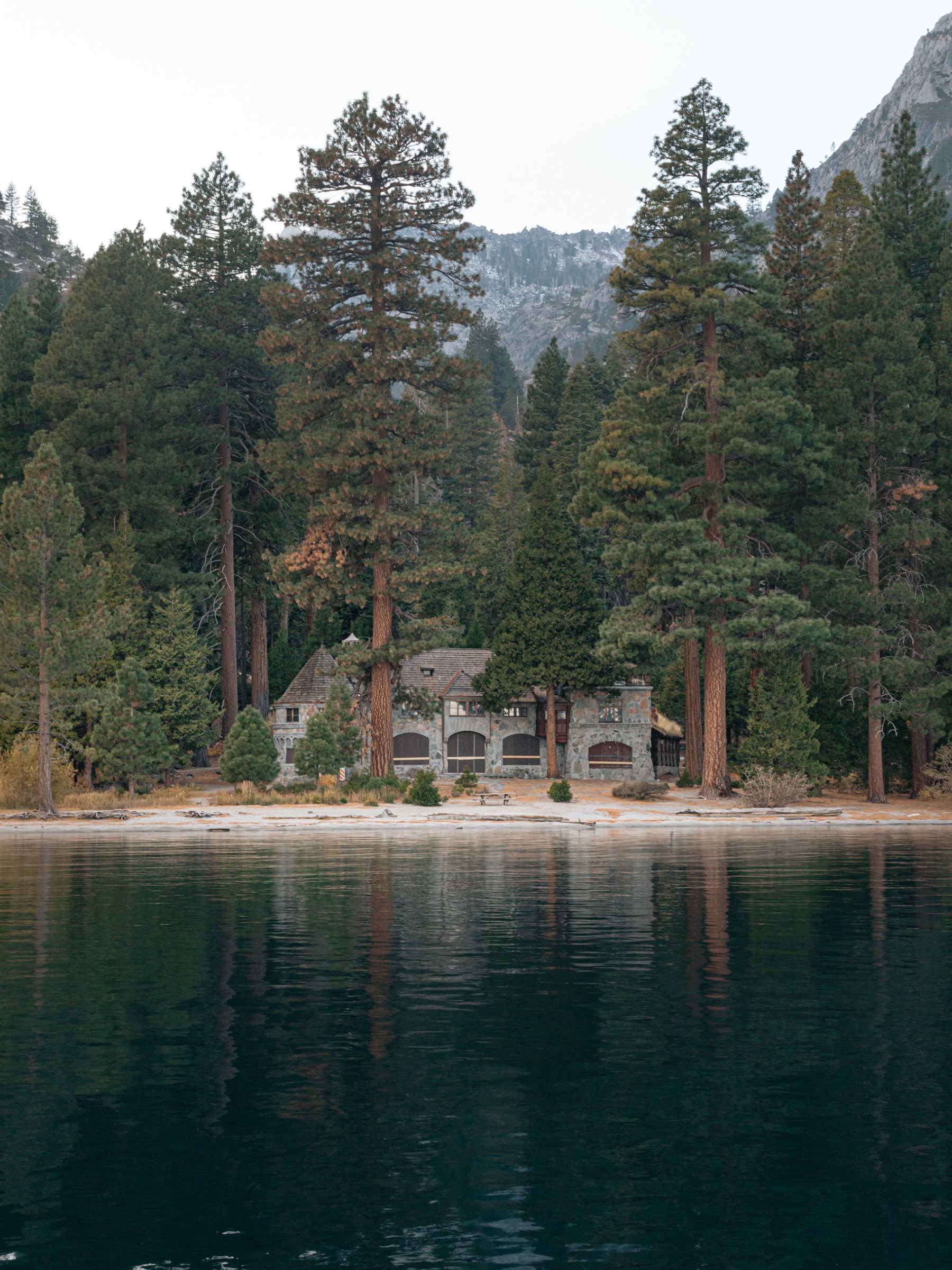 a body of water surrounded by trees