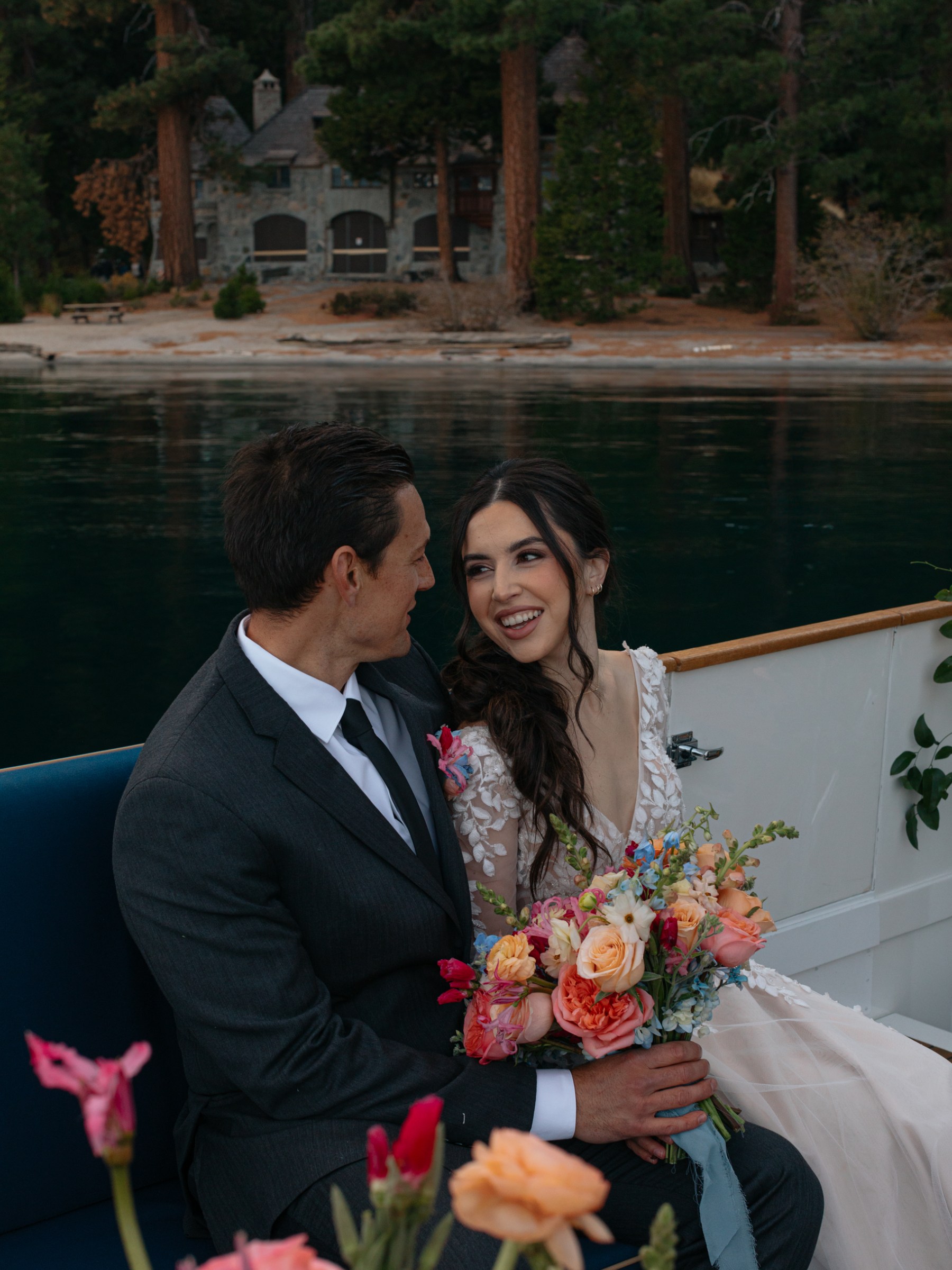 a person in a suit holding a flower
