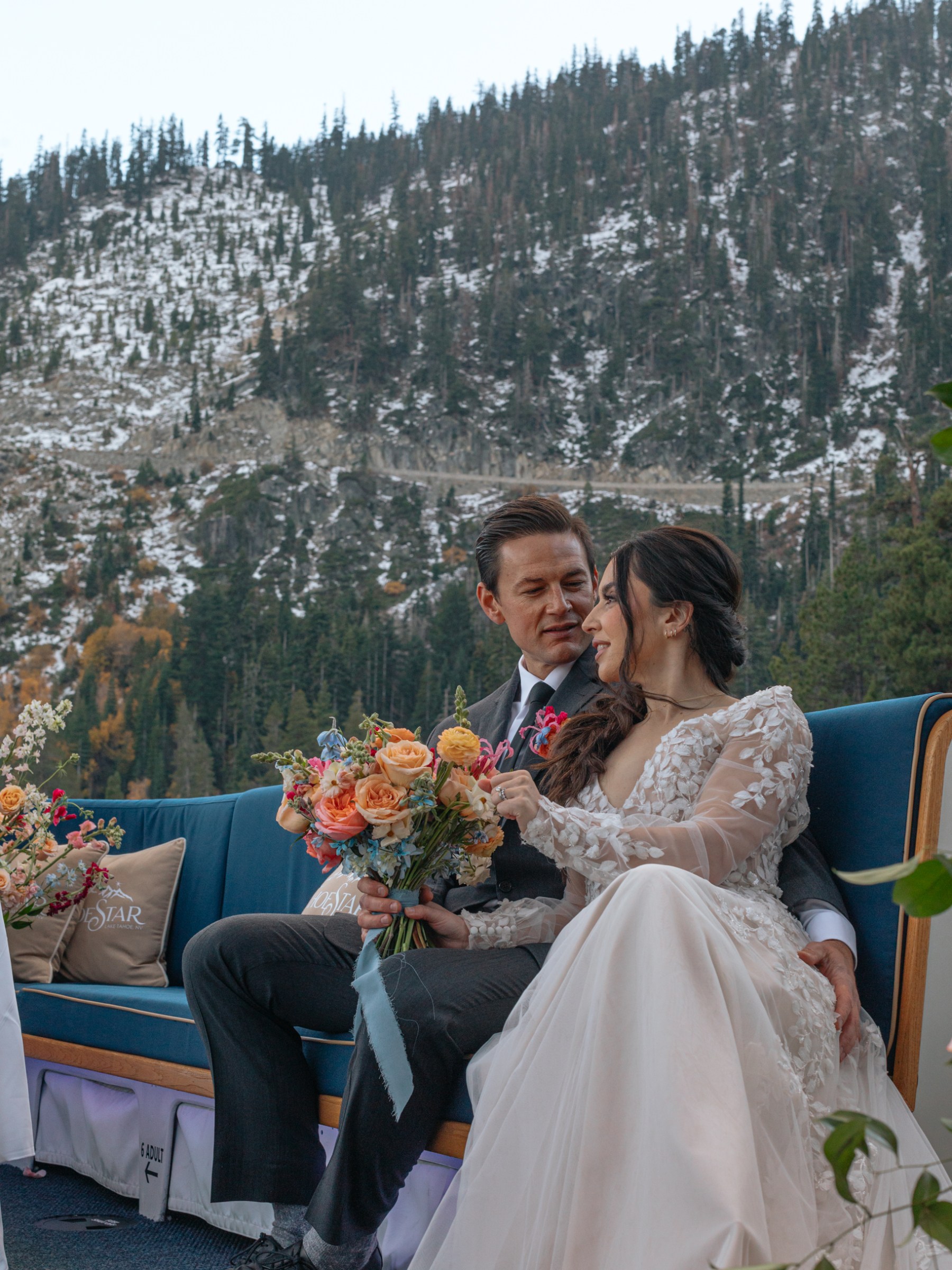 a woman sitting in a chair talking on a cell phone