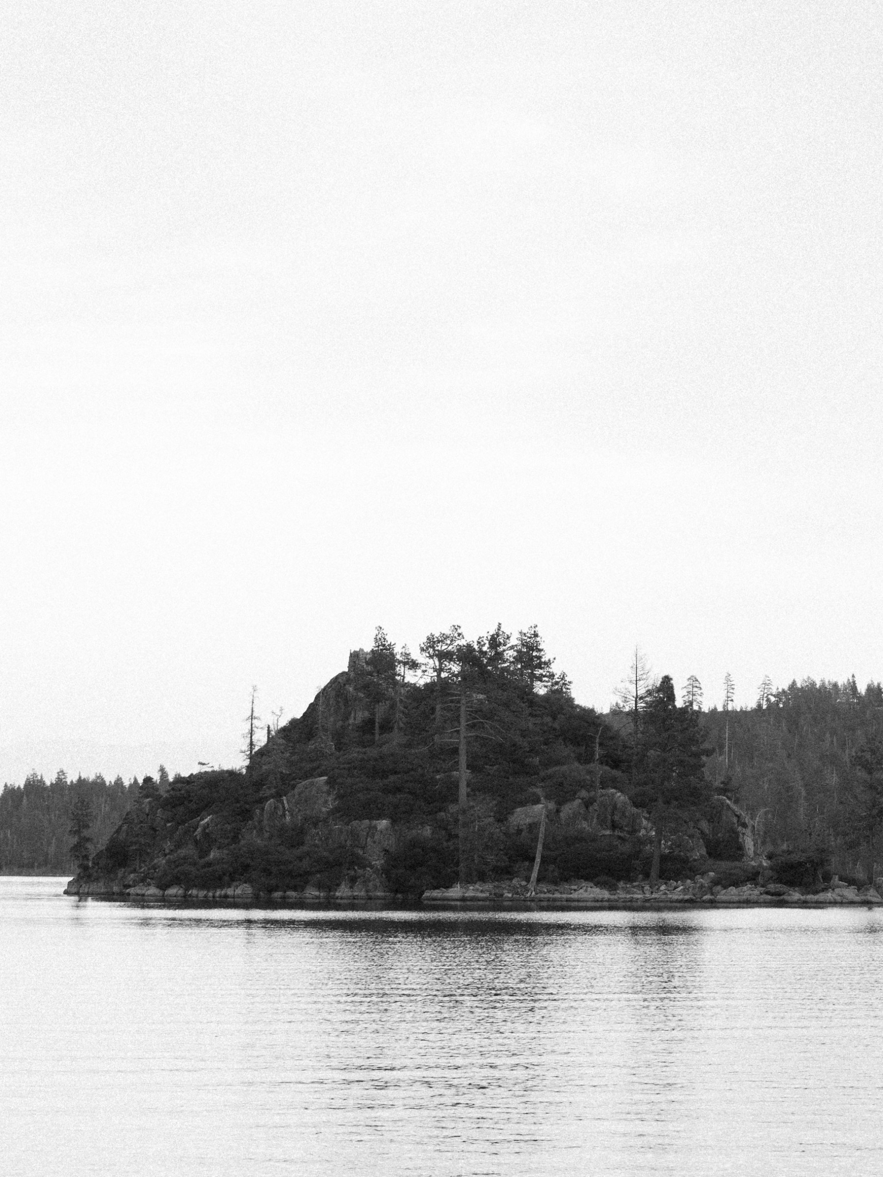 a boat on a lake next to a body of water