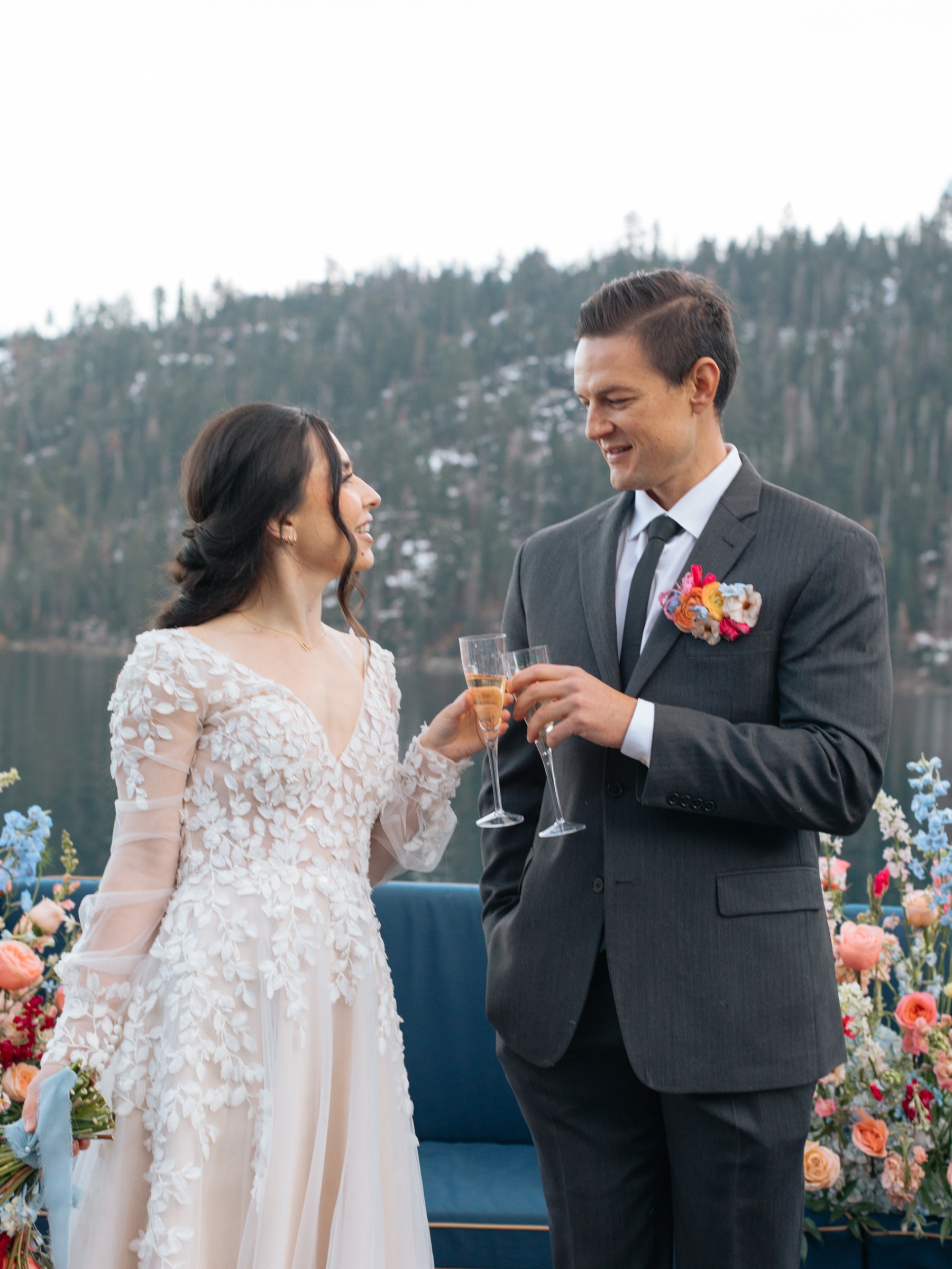 a woman standing next to a man in a suit and tie