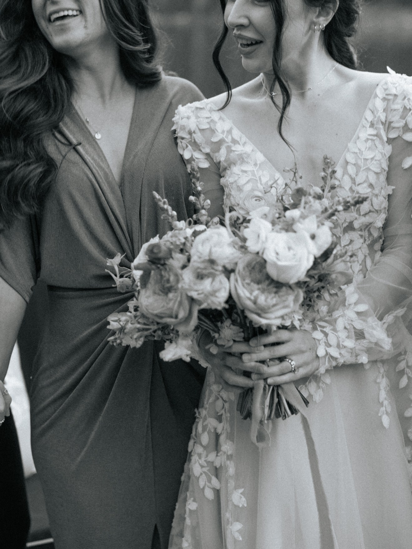 a couple of people that are standing in a wedding dress