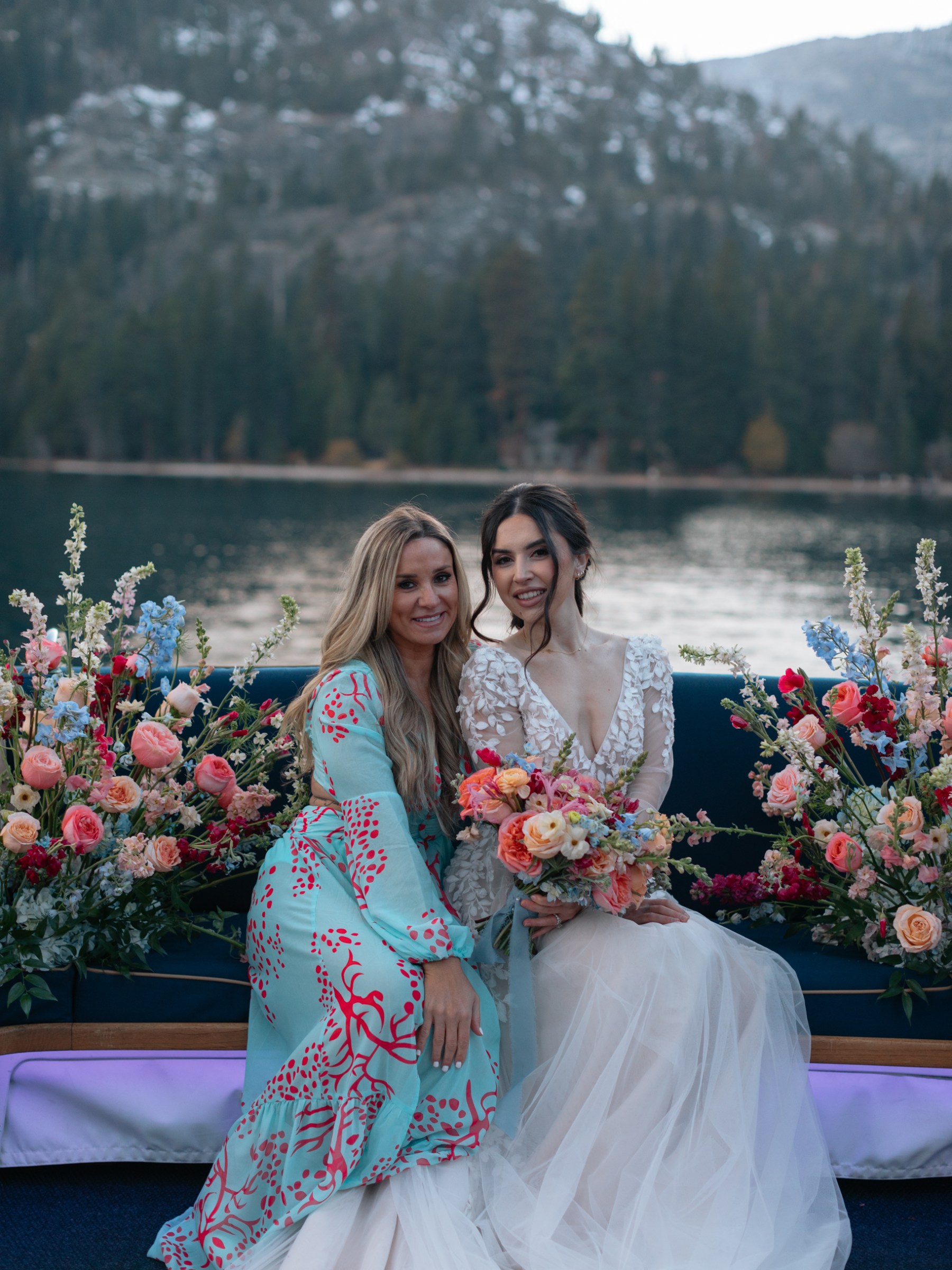 a woman standing in front of a flower