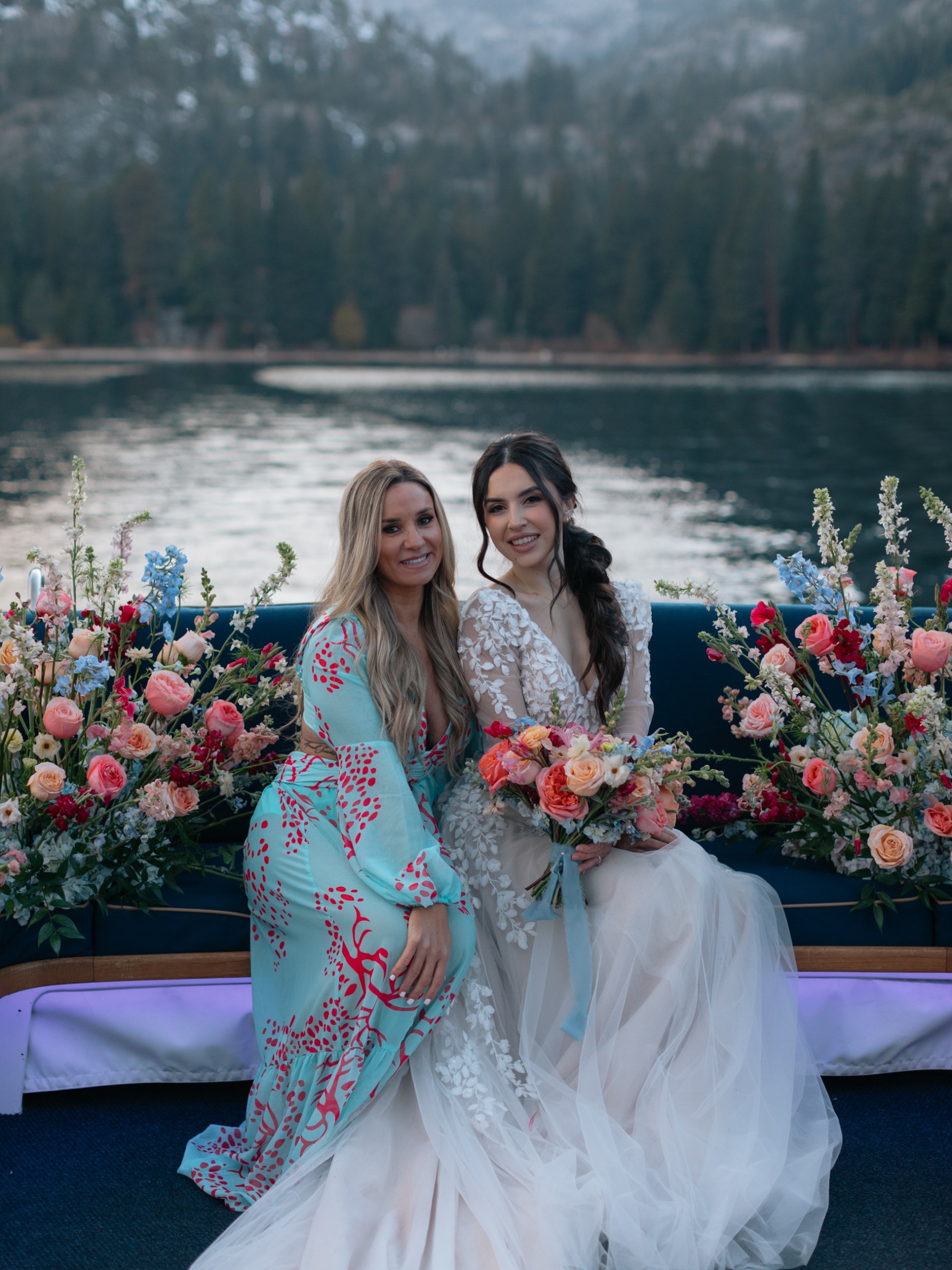 a woman standing in front of a mountain